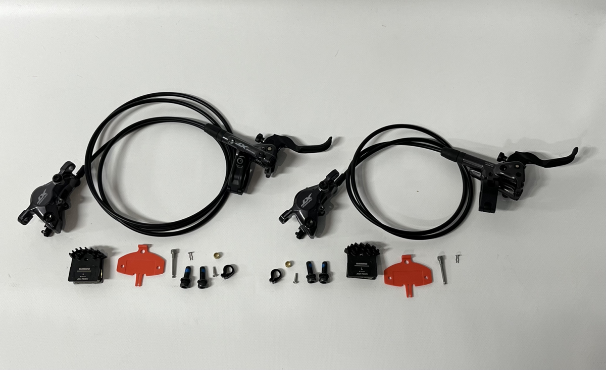 Shimano XT M8100 Voor + Achter Resin Schijfrem Set